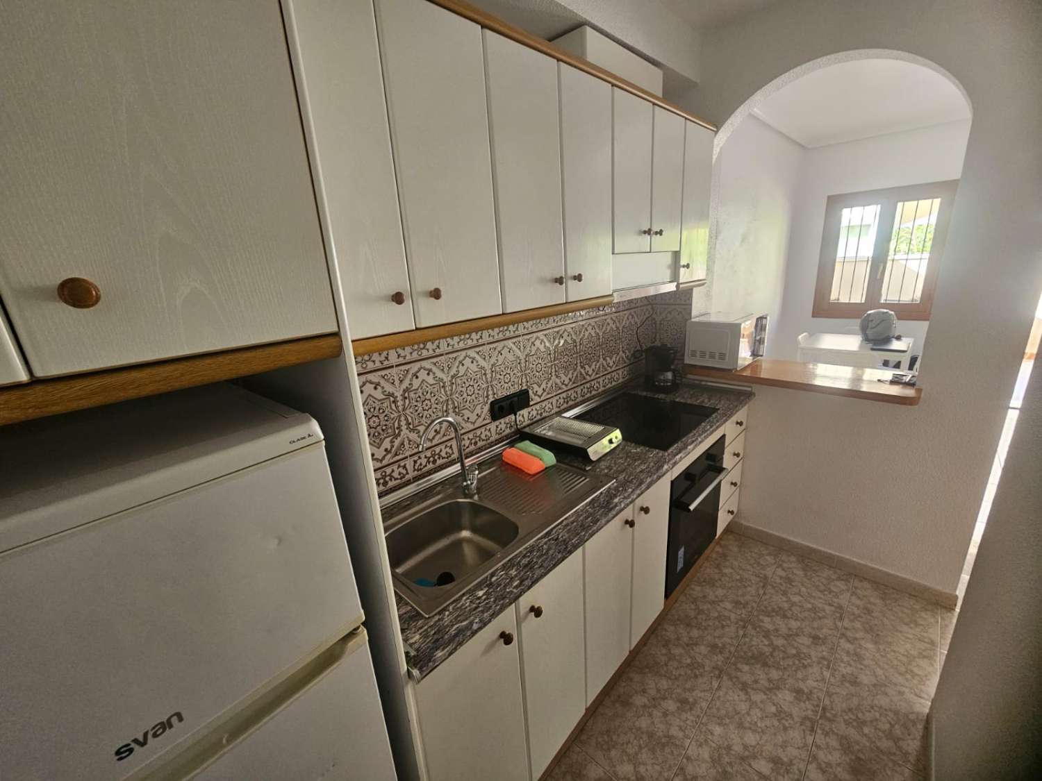APARTAMENTO EN PLANTA BAJA CON GRAN PATIO PRIVADO, PISCINA Y ALTA RENTABILIDAD EN PLAYA FLAMENCA