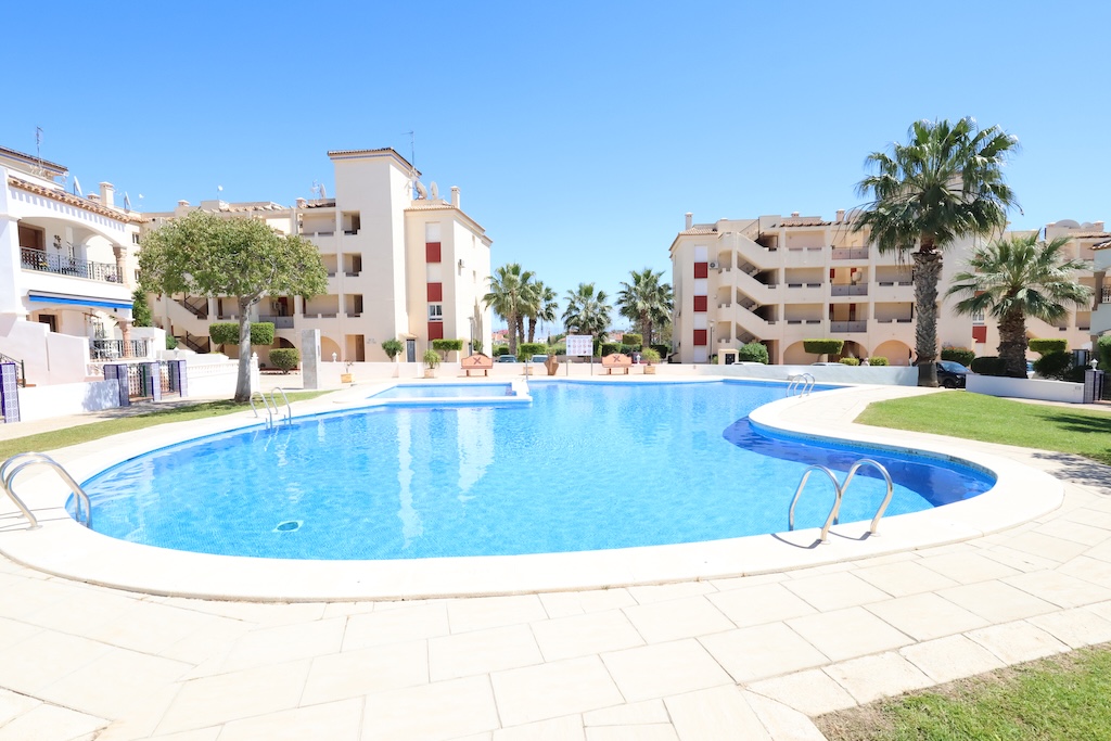 APARTAMENTO PLANTA BAJA EN RESIDENCIAL JUMILLA III CON TERRAZA, PISCINA Y PARKING EN PLAYA FLAMENCA